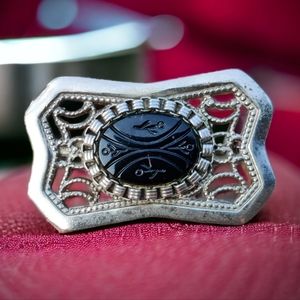 Vintage carved black onyx filigree brooch